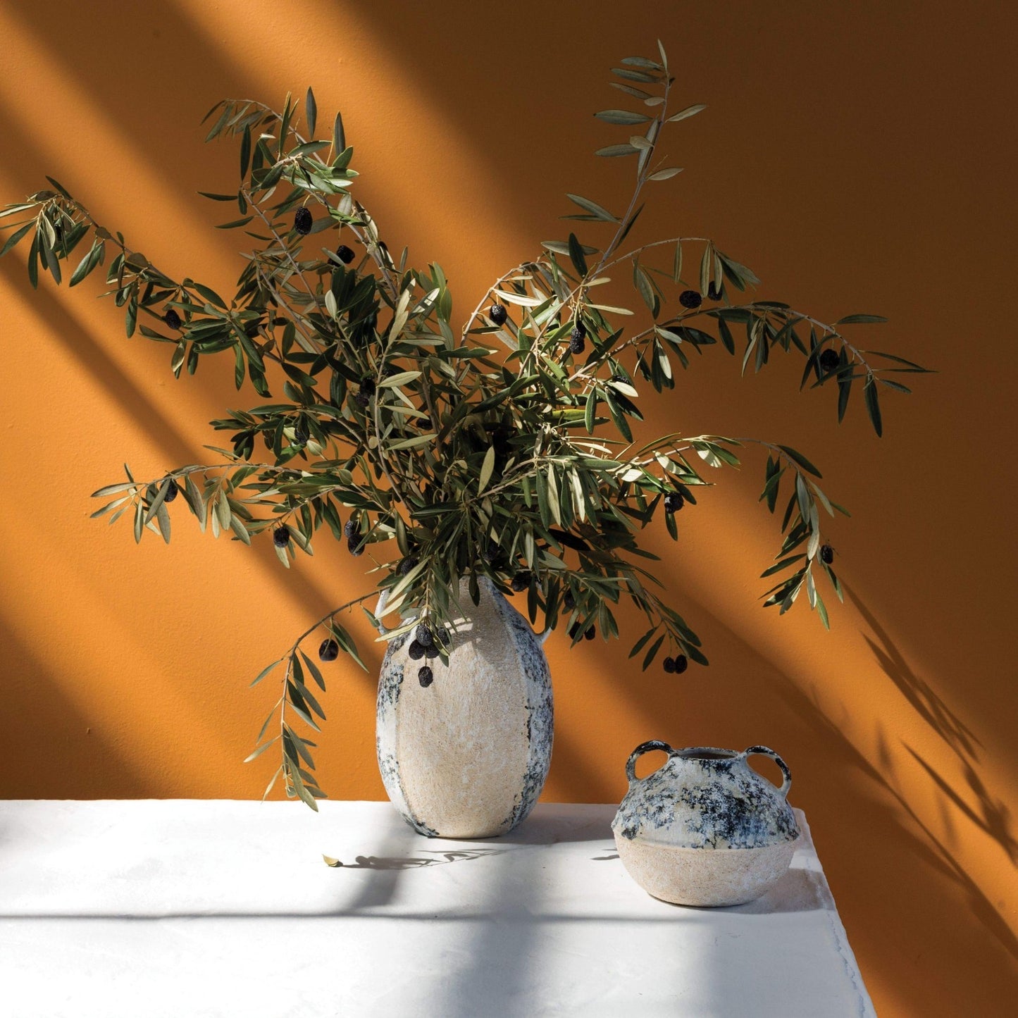 sandy texture and radiant blue hue, this vase offers a fresh, contemporary loo